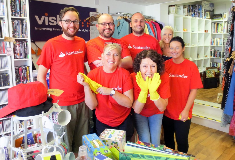 A picture of Santander staff with shop manager Penny at the Loughborough charity shop.