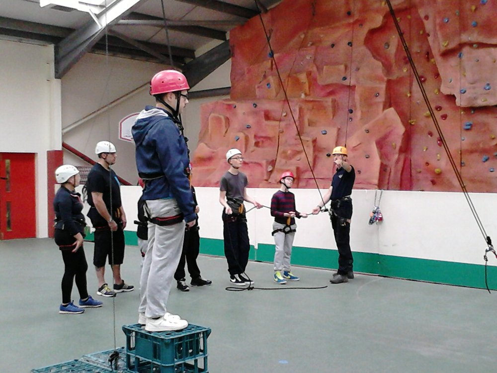 A picture of children and young people taking part in a crate stacking activity.