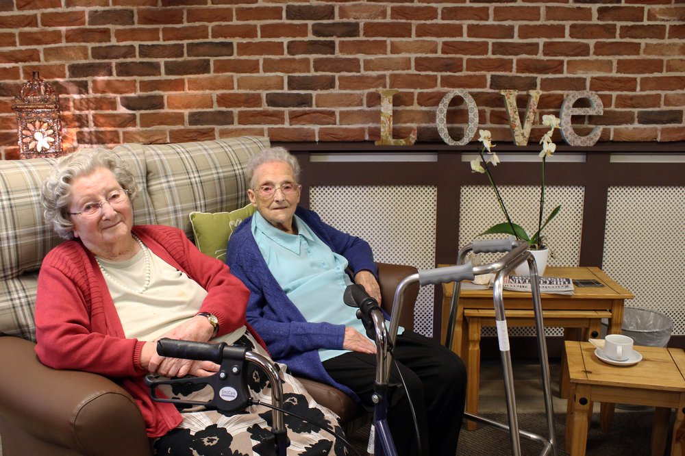 A picture of two residents sitting in the new lounge area at New Wycliffe Home.