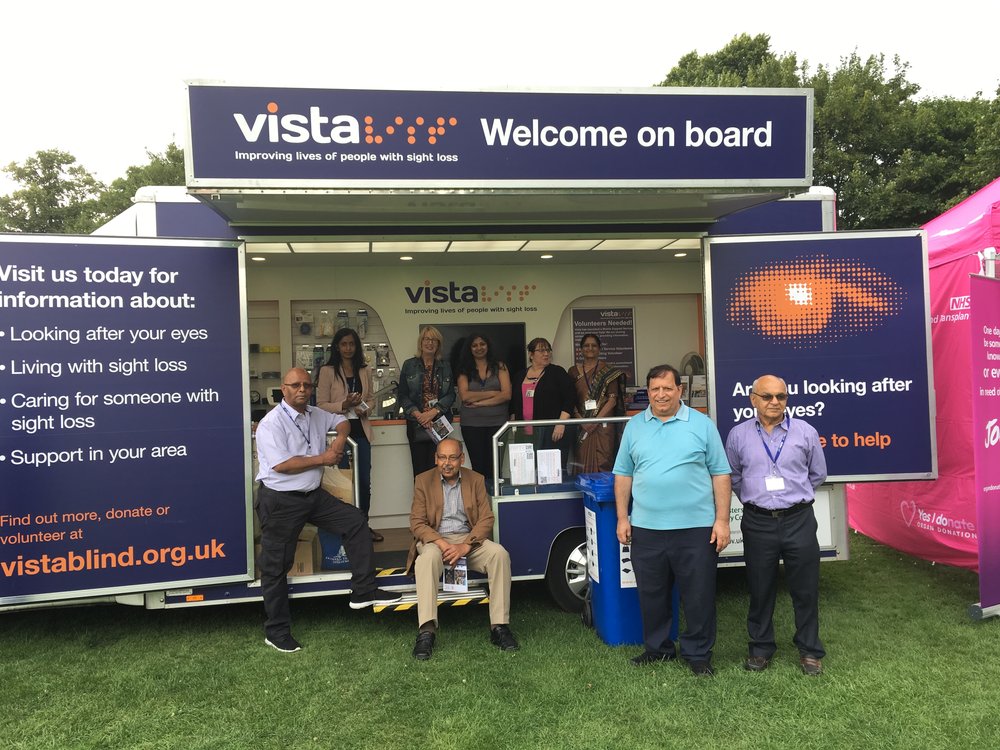 A picture of Vista staff and volunteers on the Mobile Support Service vehicle.