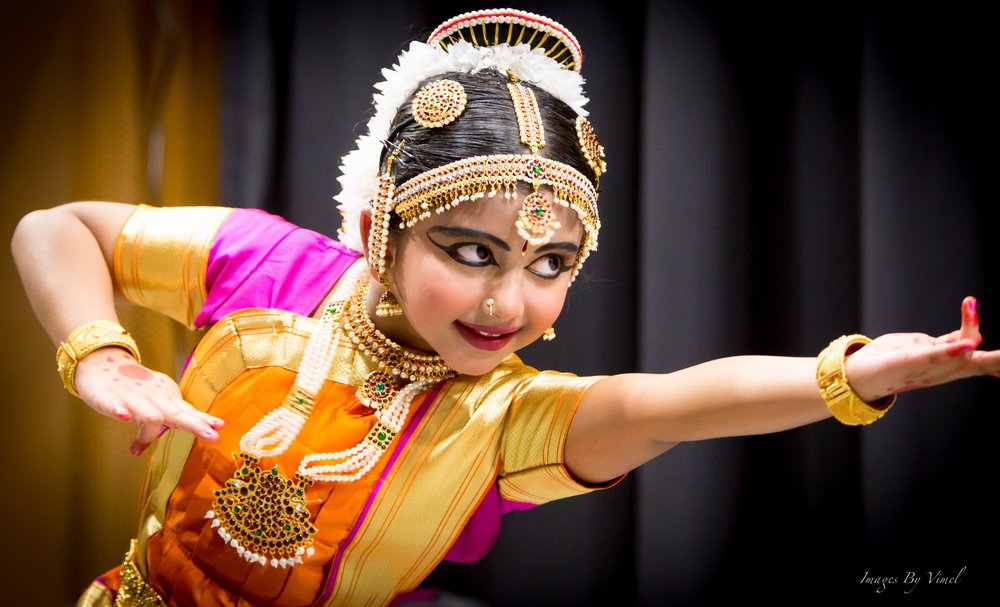 A picture of a girl performing in a dance routine.