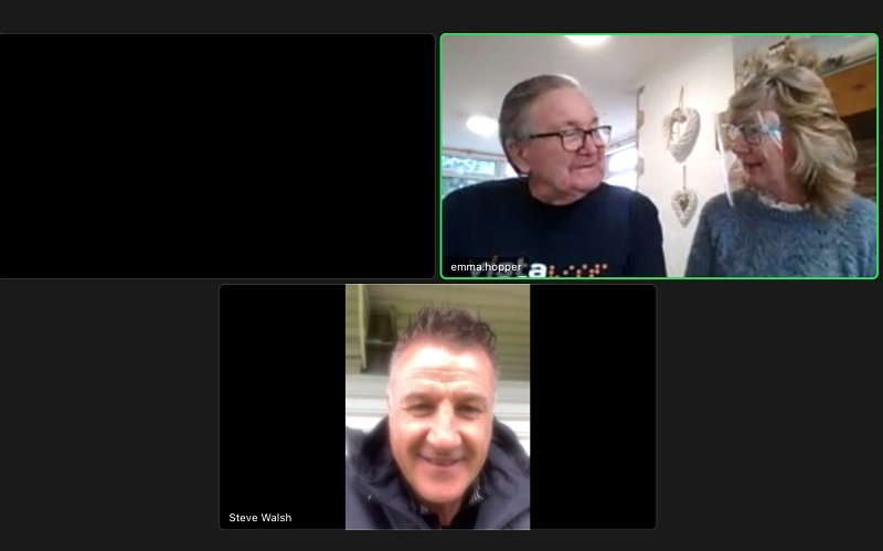 A screenshot of Leicester City Football Club legend Steve Walsh on Zoom talking to Tony and Teresa at Vista's Kathleen Rutland home wearing Vista t-shirts.