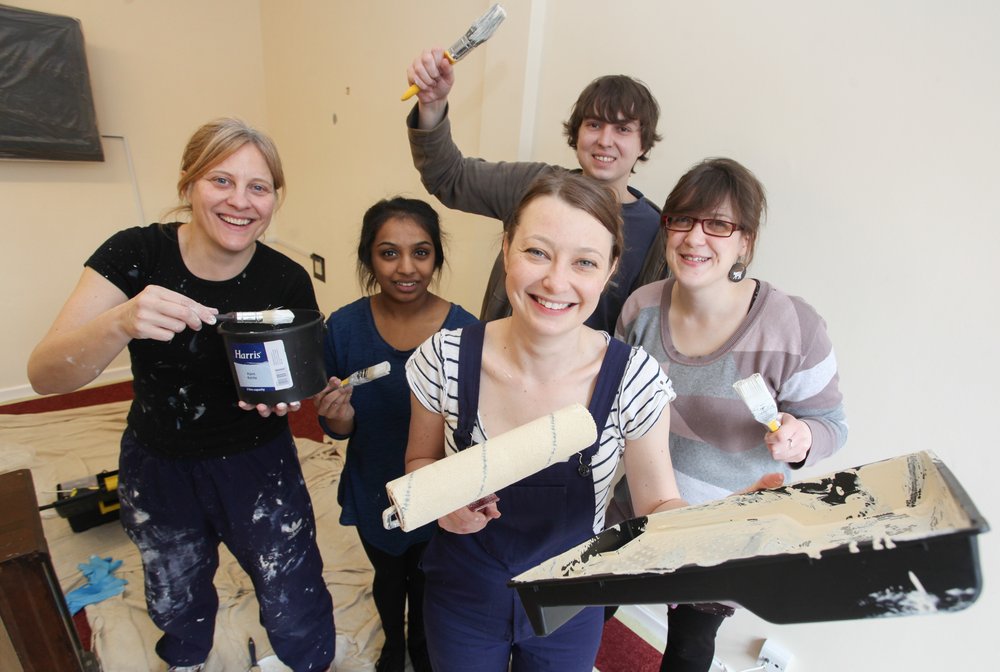 A picture of Nelsons staff members with decorating tools.