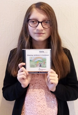 Nicole is holding up a CD cover which she designed during lockdown with Vista's Children and Young People team. It has a rainbow on it.