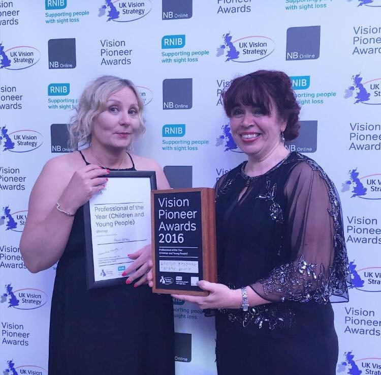 A picture of Paula Varney and Naomi Bell holding their award and certificate