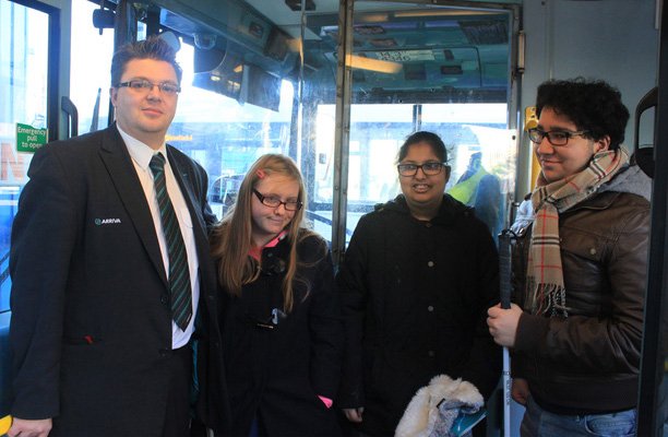 A picture of Arriva Midlands driver Darren Sewell with young people on the bus.