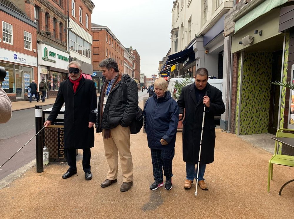 The Mayor with 3 vista representatives walking blindfolded with cane down Belvoir street