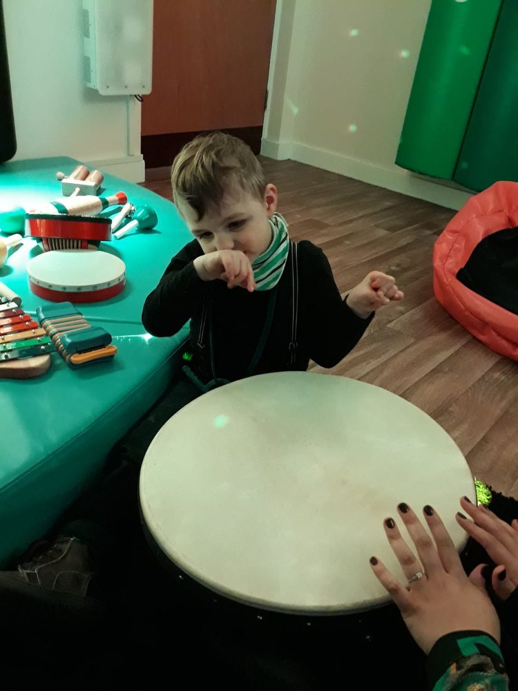 Image of little boy playing the the sensory room