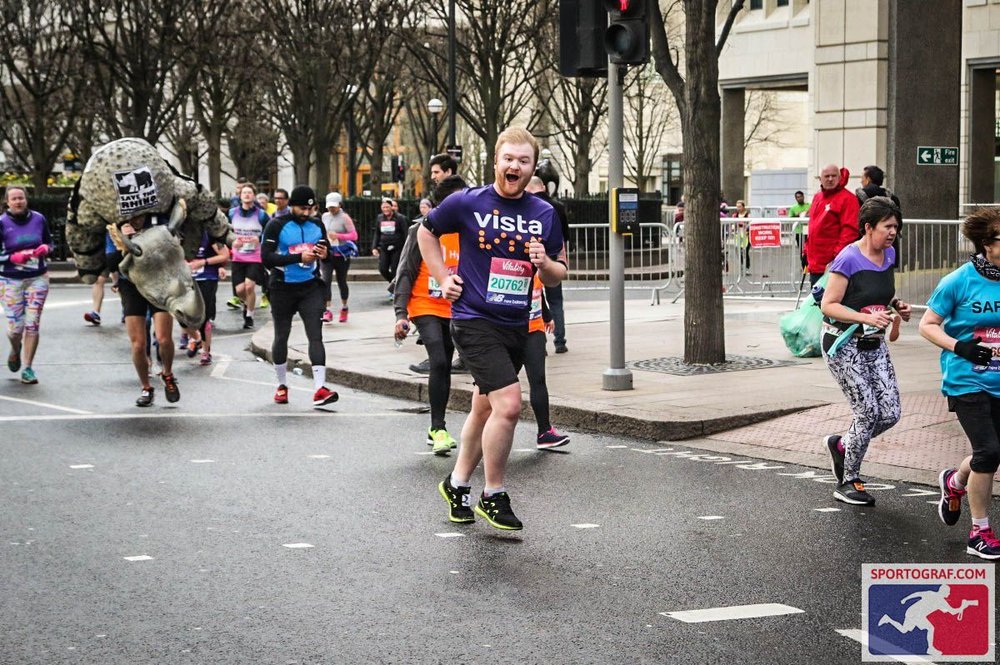 Adam running with an utterly ludicrous smile on his face.