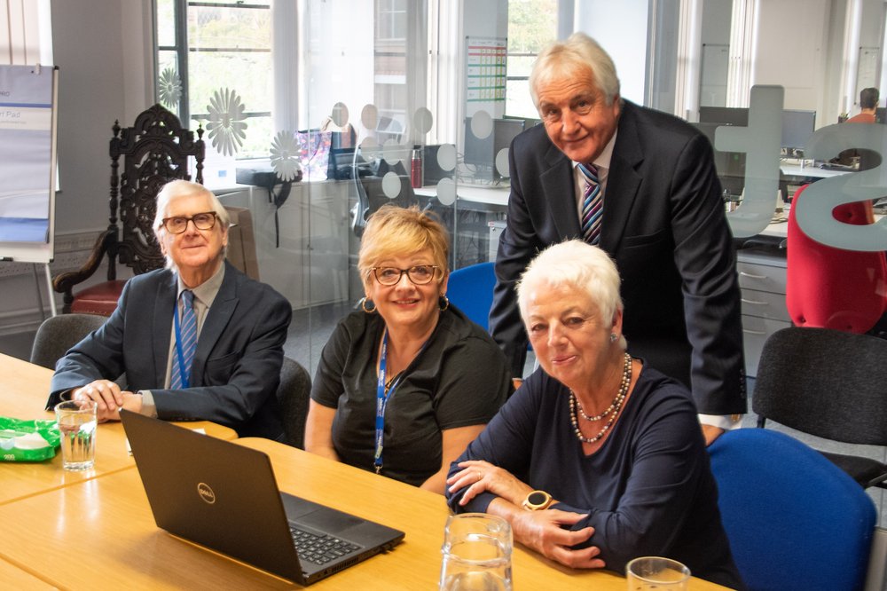 Image is of staff members from Vista and Peter Kinder from Leicestershire and Rutland Freemasons at Vista's head office.