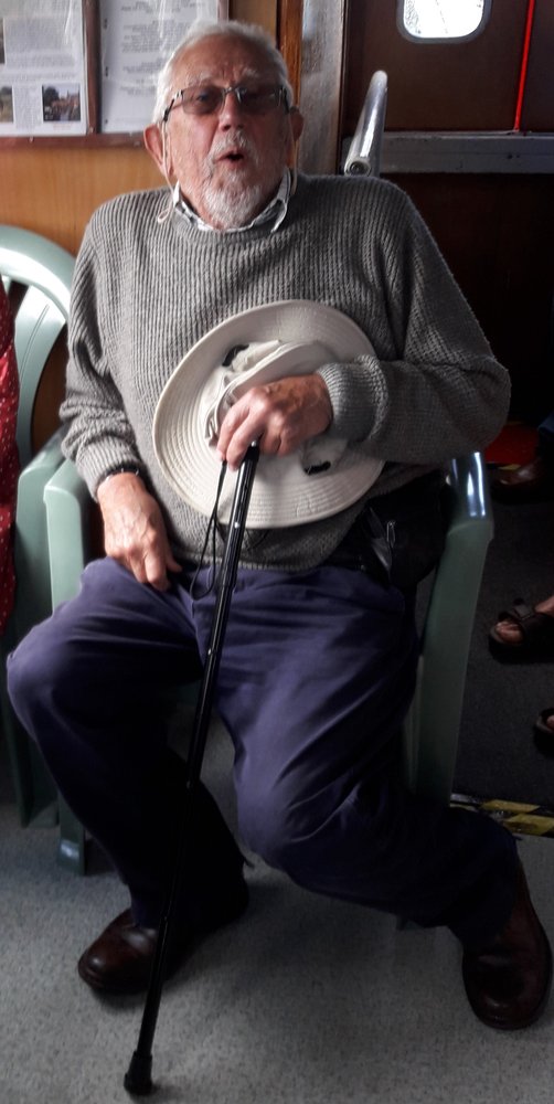 Image is of Dr Tom Hailstone sitting in a chair.