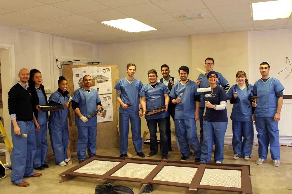 A picture of the Design Studio Architects team with Paul Bott and Jaspreet Kaur painting the New Wycliffe Home lounge.