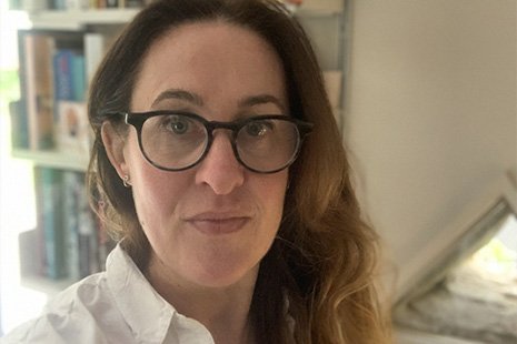 [Image Description: Vista CEO Louise Wright with a bookcase behind her.]