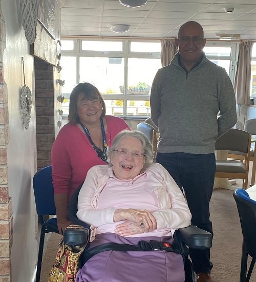 Image is of Susan Hoath, CEO at Vista, Mike Kapur OBE and a resident at our Kathleen Rutland Home smiling.