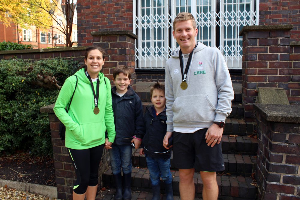 A picture of Matt Nurse, his wife and two sons after running the Leicester Half Marathon.