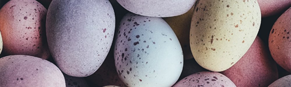 [Image Description: Image of a pile of Mini Eggs on a table.]