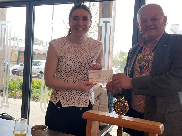 Kevin at Rotary Club of Ashby de la Zouch Castle presenting Community Fundraiser Libby Clegg with a cheque.