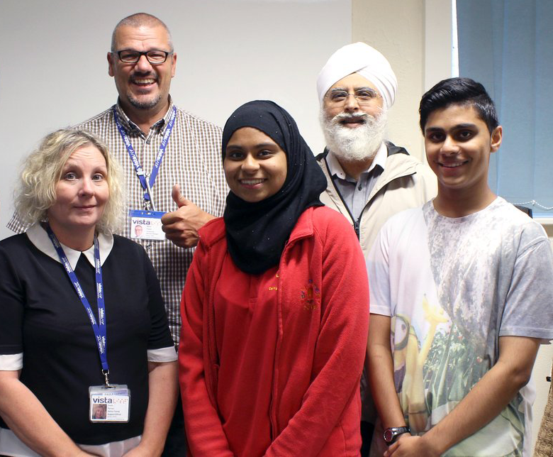 A picture of Steve smiling with Vista staff and service users.