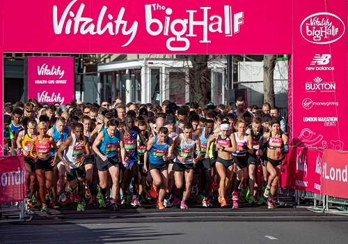 Image is of a crowd running under the Vitality Big Half banner.
