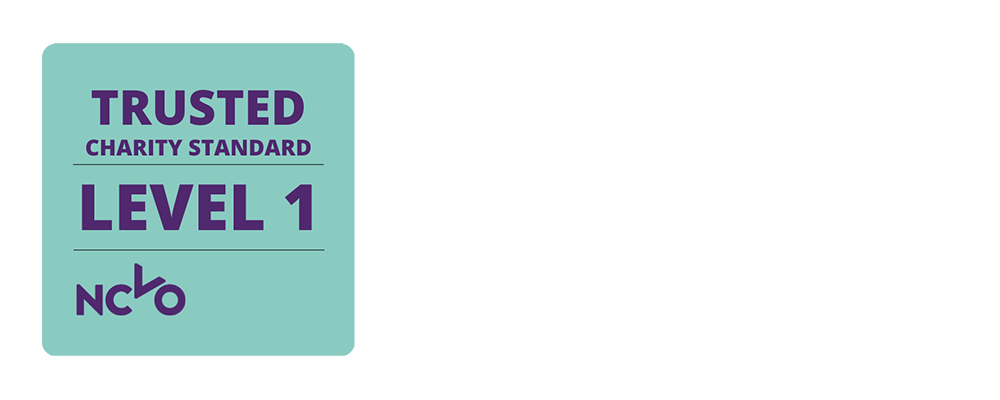 [Image Description: Purple text on an aqua background reading 'Trusted Charity Standard - Level 1 - NCVO']