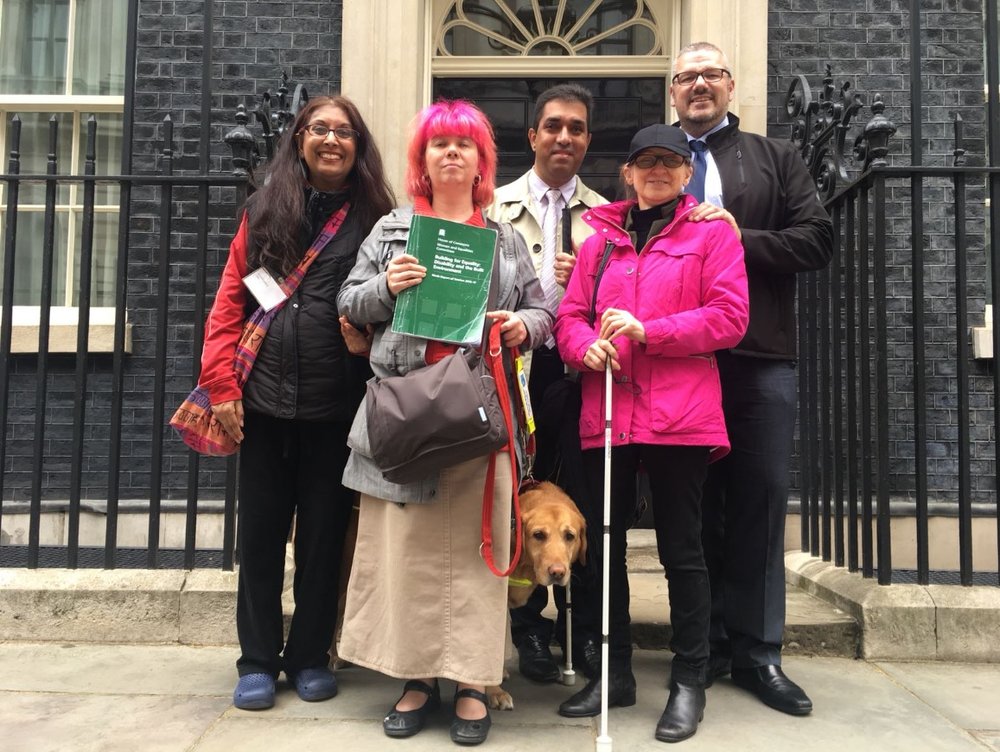 Sight loss campaigners handing the petition into number 10